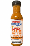 Bottle of Detroit Seafood Spot Spicy Garlic Butter Sauce on a white background
